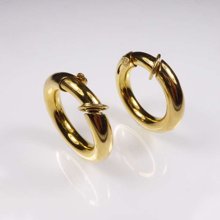 Pair of tubular gold hoop earrings of bold design